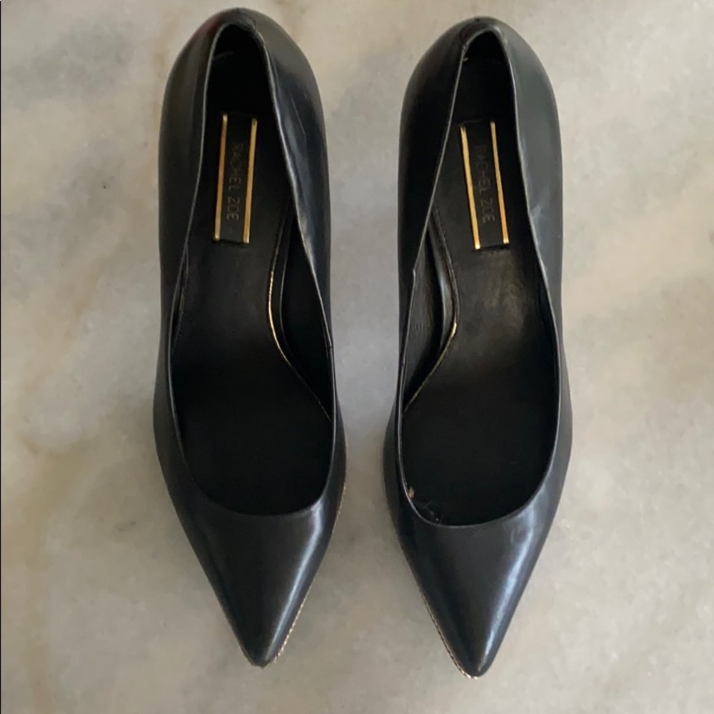 Black leather pumps with zipper detail